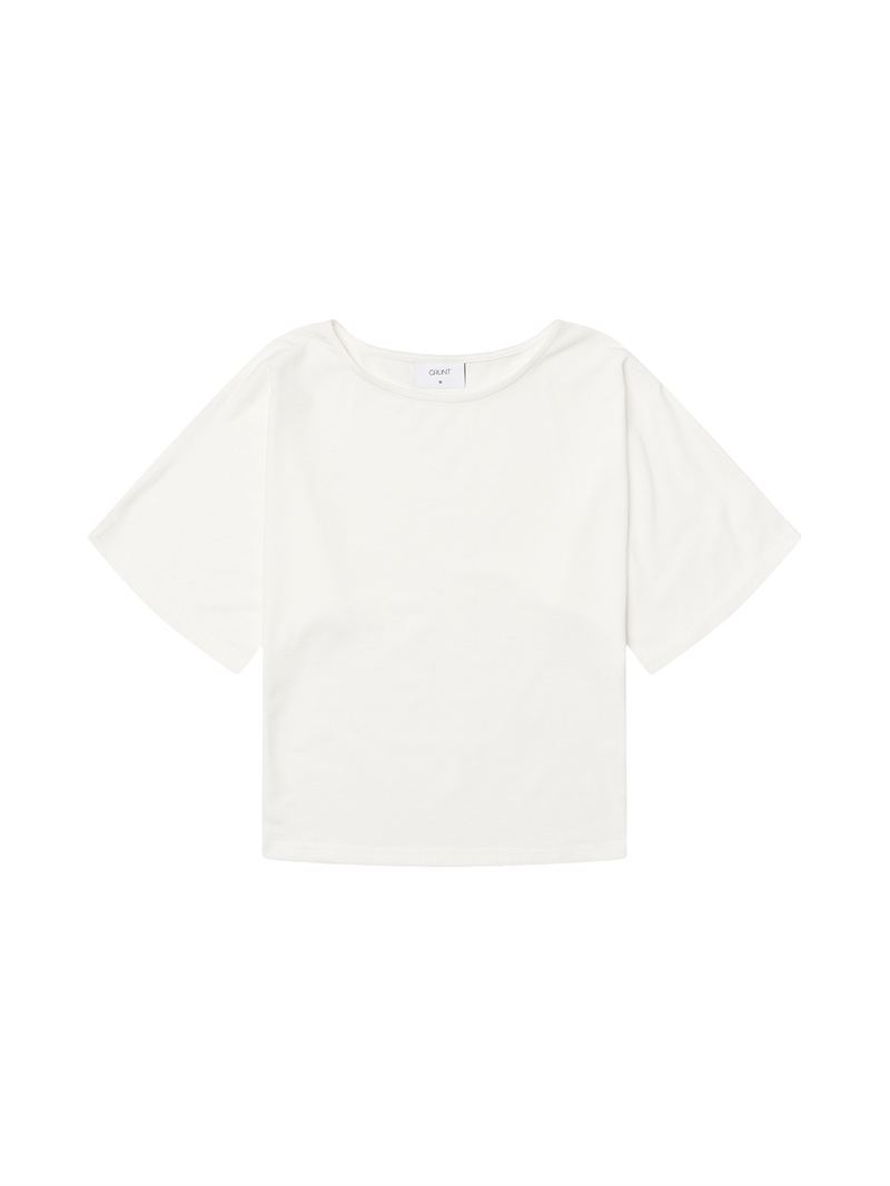 Grunt Nova Top – Let top til piger med stilrent og moderne look i hvid